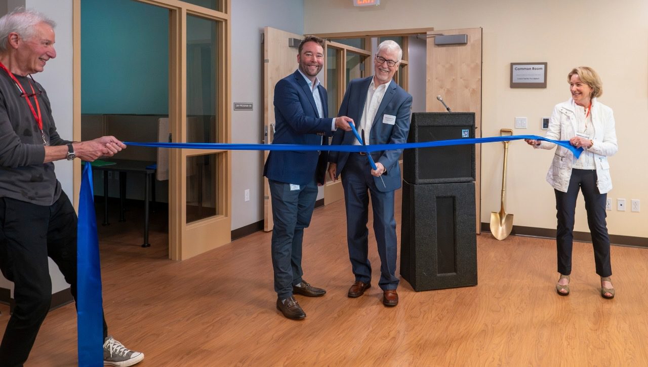 Haven Executive Director Will Towne and former ED Michael Redmond cut the ceremonial ribbon, held by Board President Kathy Welling and VP Jim Zien